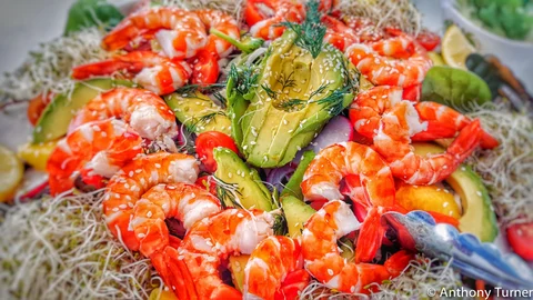 Prawns and avocado served on board
