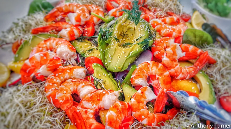 Seafood and vegetables served on board