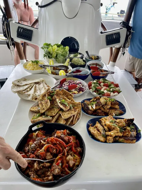 A shared lunch spread on board