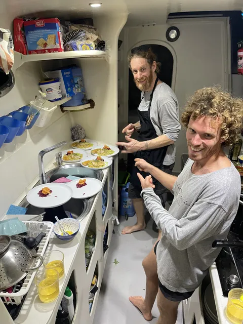 The crew cooking in the galley