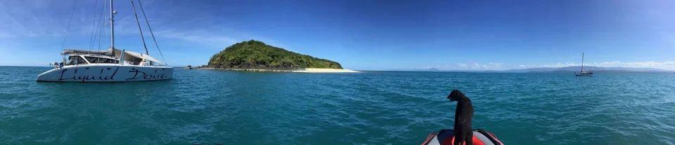 Liquid Desire near an island, panoramic view