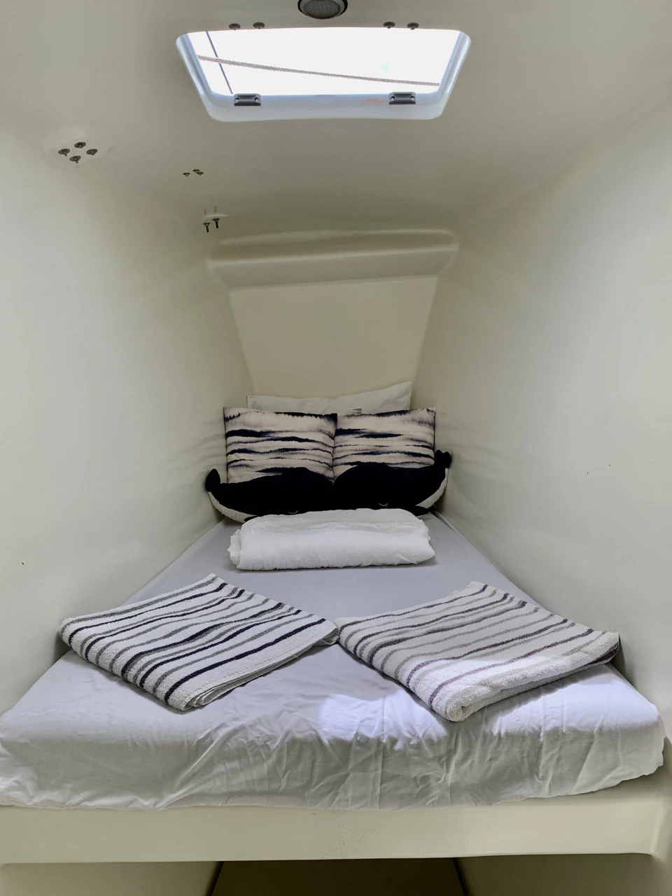 A single berth beneath a hatch