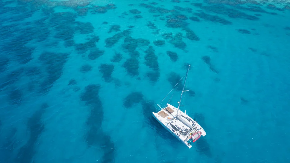 The yacht over coral, viewed from above