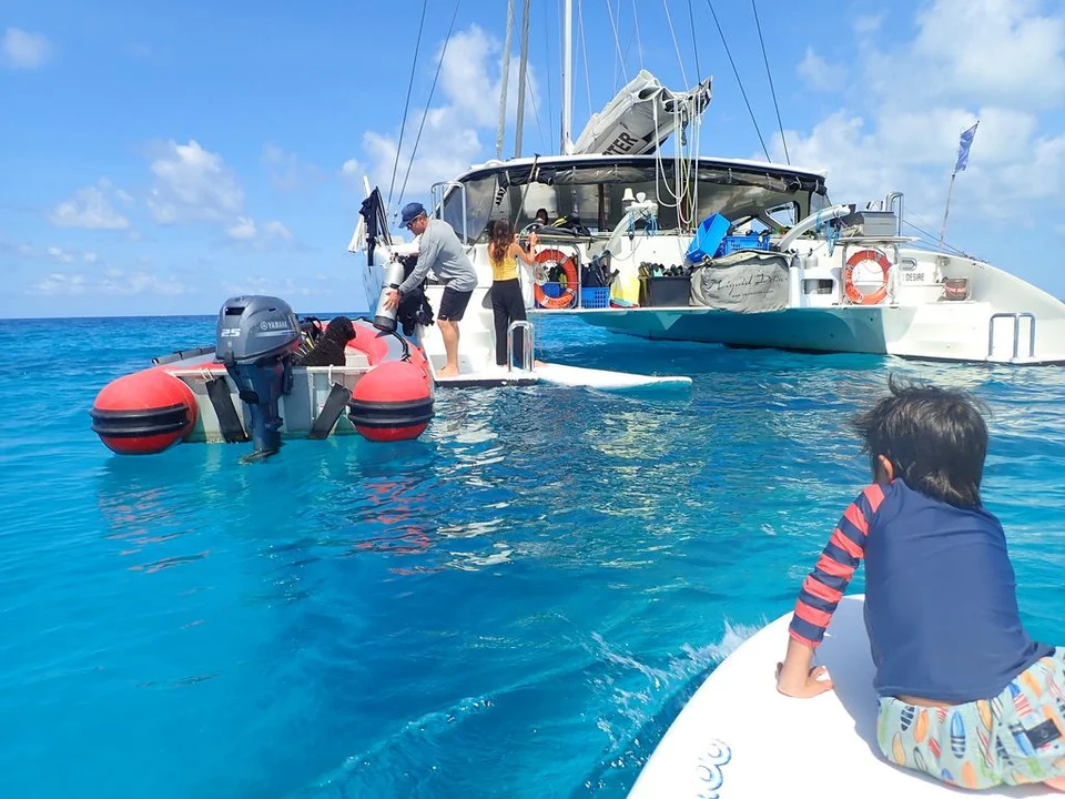 Guests travelling between the dinghy and yacht