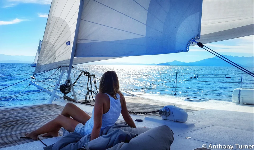 Resting on deck under the sails