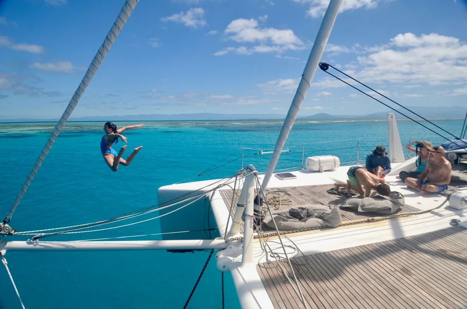 Swinging above the water from the bow