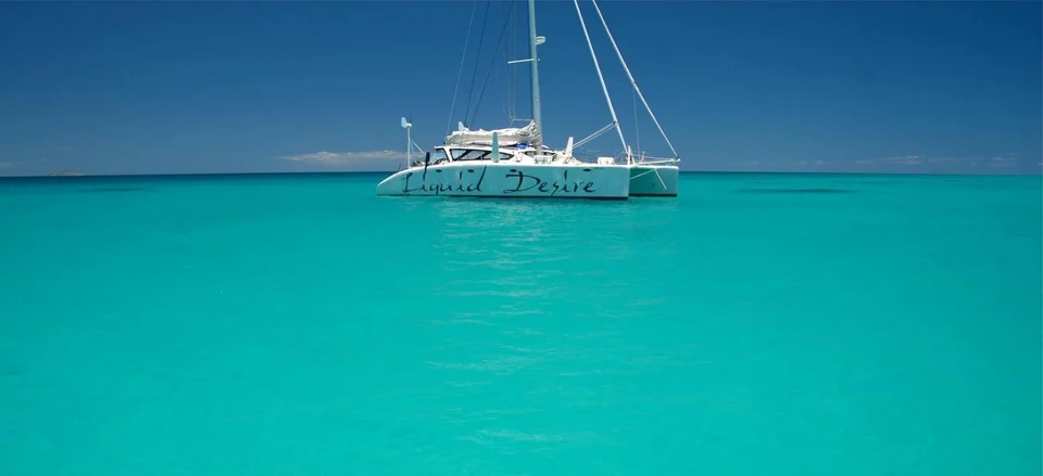 Liquid Desire on still turquoise water