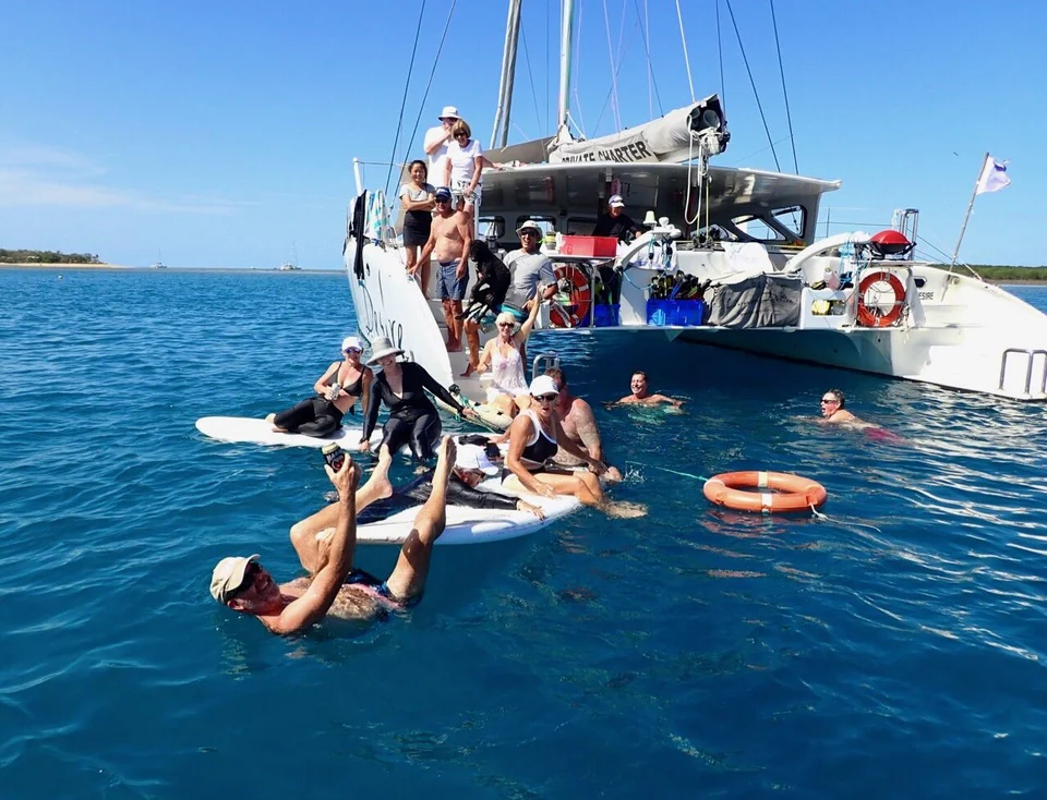 Guests swimming from the aft steps
