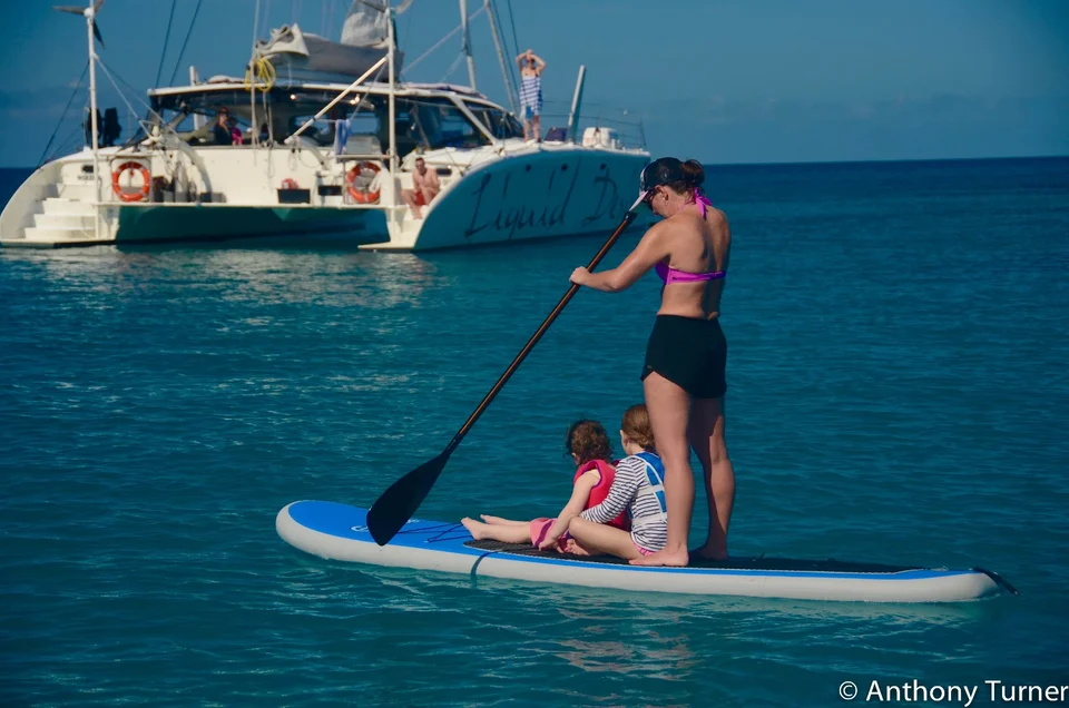 Guests sharing a paddleboard