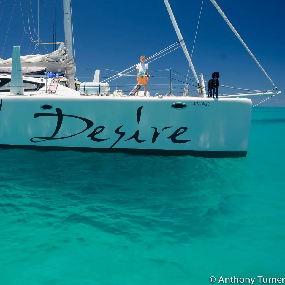 The bow and hull lettering above clear water
