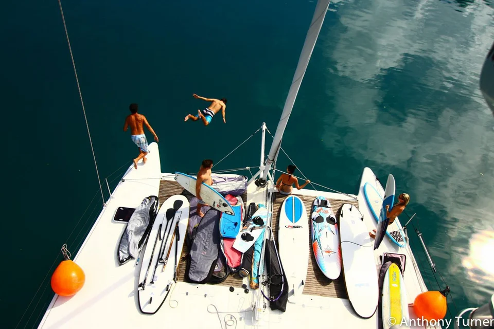 Guests swimming from the yacht, viewed above