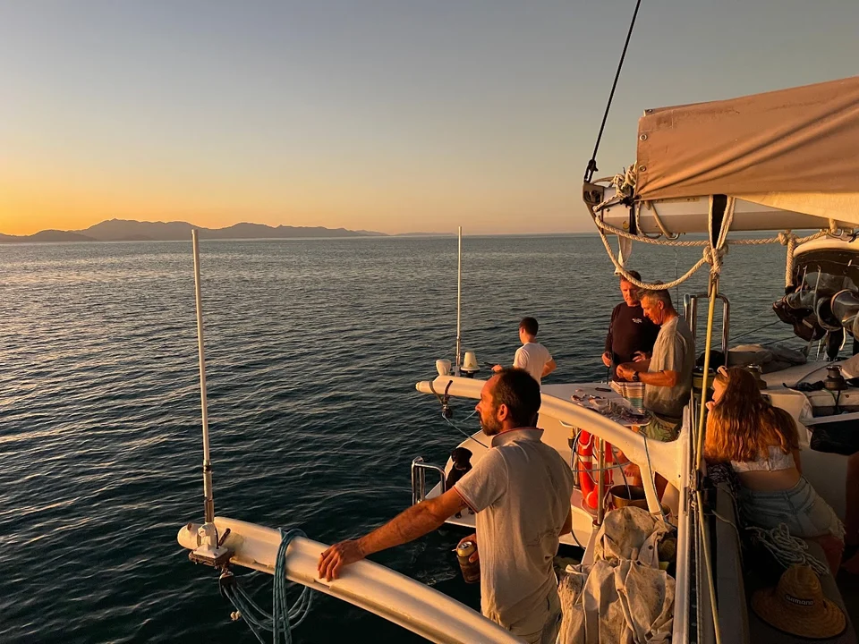 Guests on the bow at sunset
