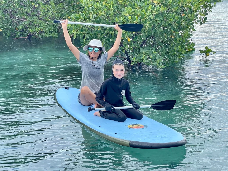 Two guests on paddleboards