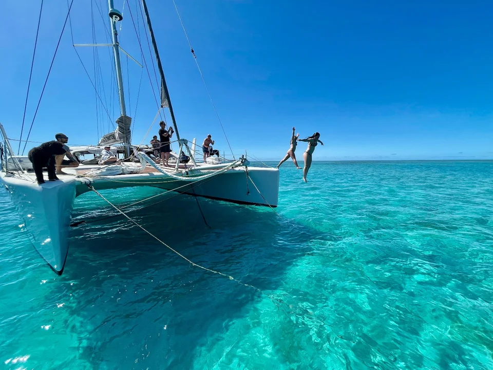 Jumping into clear water from the bow