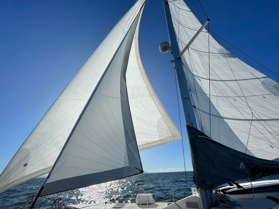 White sails against blue sky