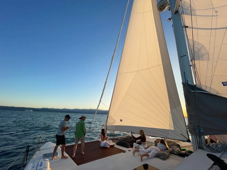Guests relaxing beneath the sails